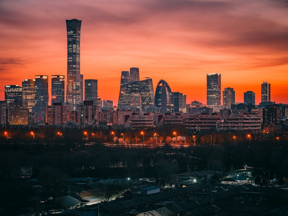 a view of a city skyline at sunset