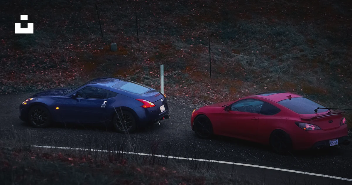 Two cars parked side by side on a road photo – Free Automobile Image on ...