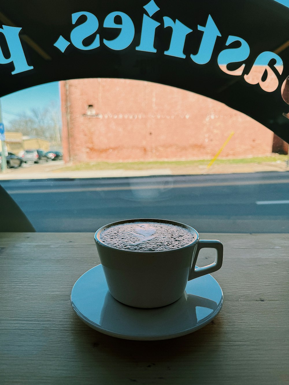 a cup of coffee sitting on top of a saucer