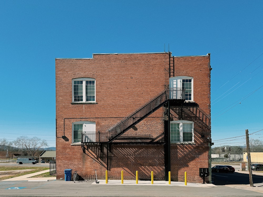 a tall brick building with a fire escape