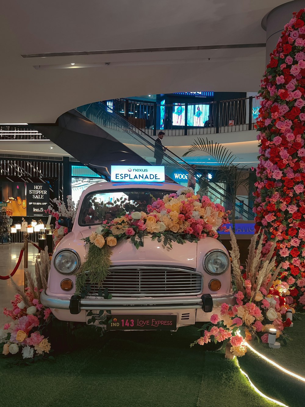 a white car with flowers on the front of it