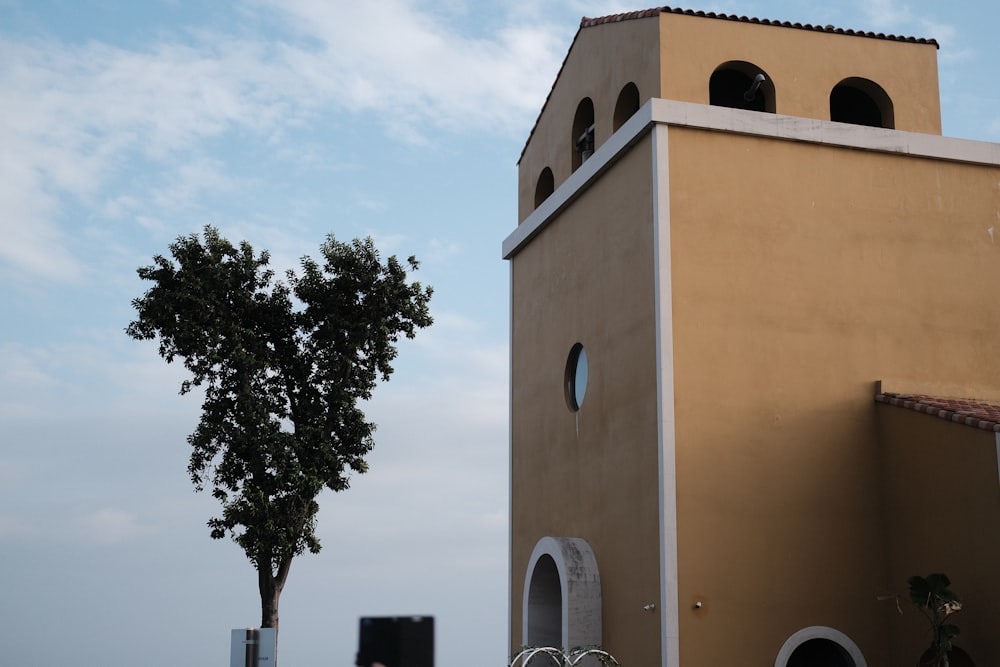 a tall building with a clock on the side of it