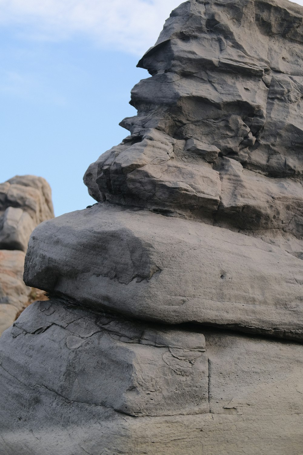 a close up of a rock formation with a sky background