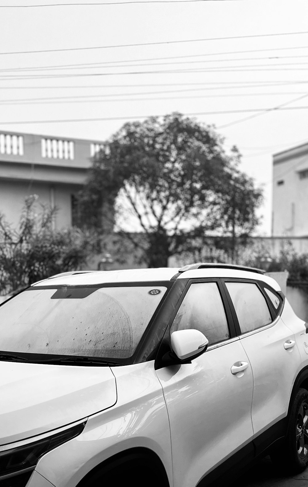 a white car parked on the side of a road