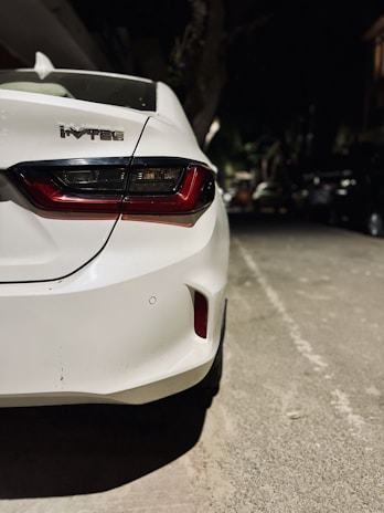 a white car parked on the side of the road