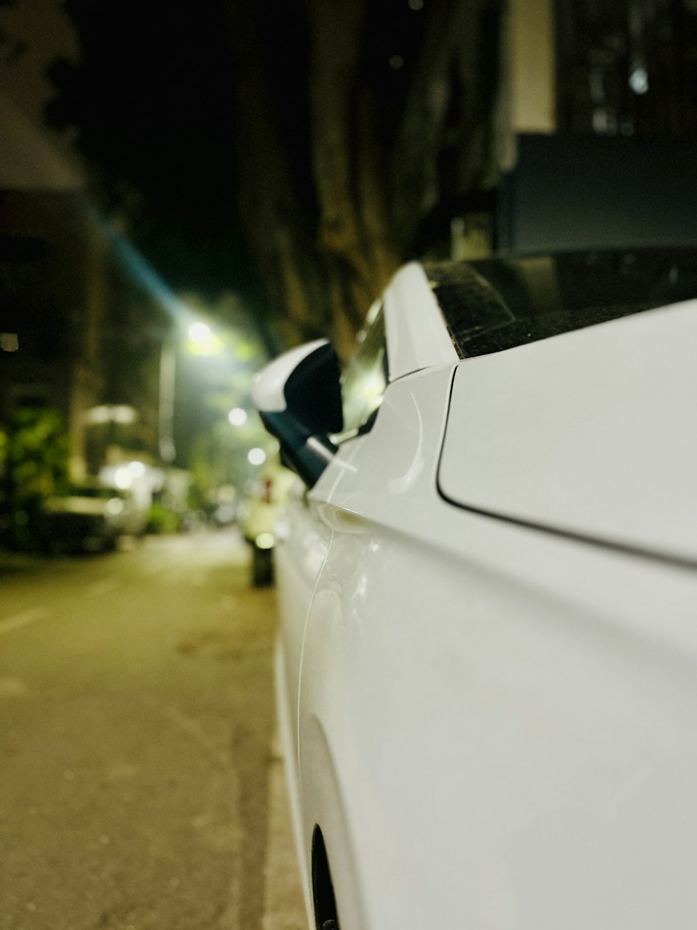 a white car parked on the side of the road