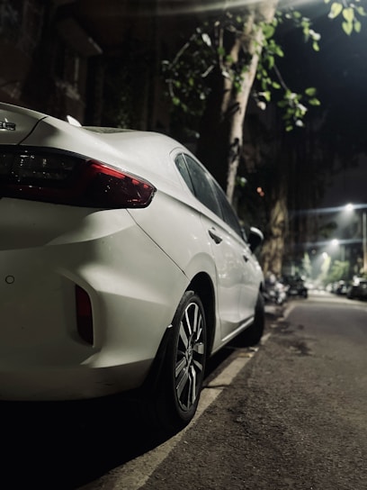 a white car parked on the side of the road