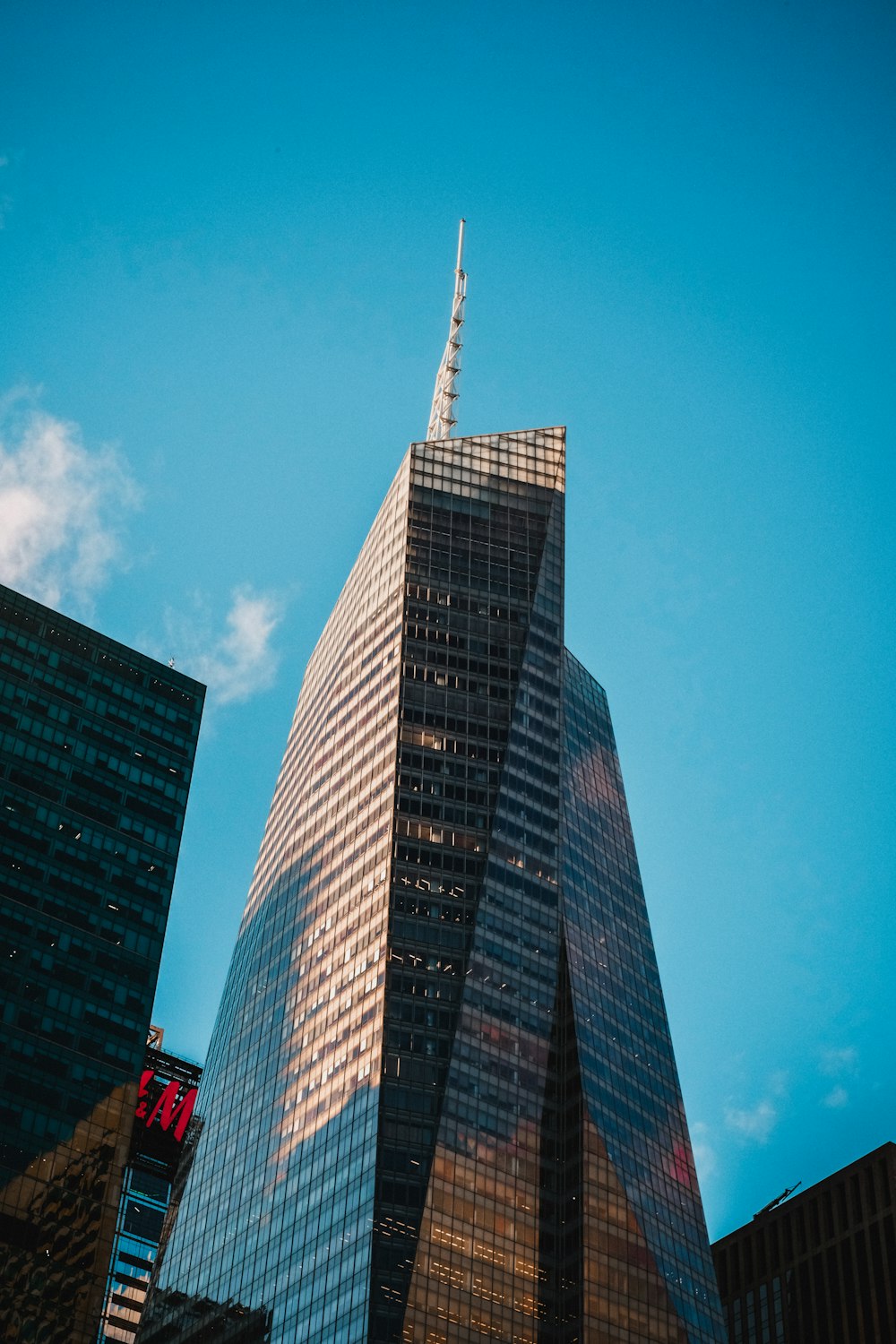 a very tall building towering over a city