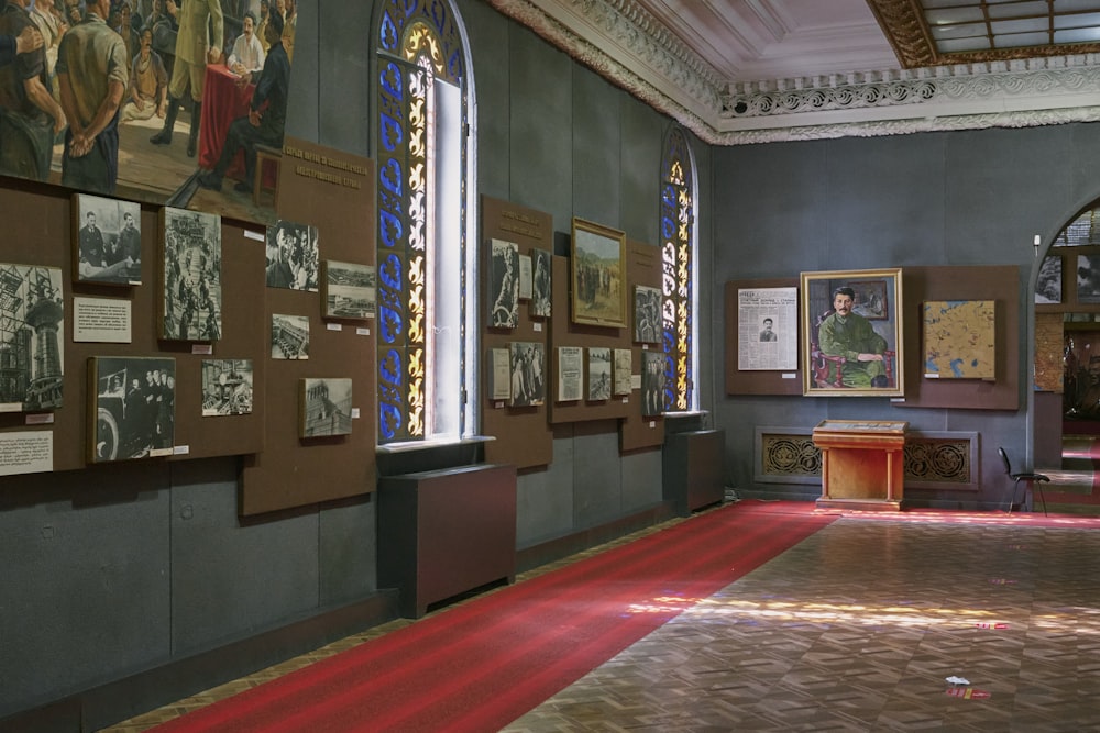 a room filled with lots of paintings and pictures