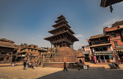 a very tall building sitting in the middle of a town