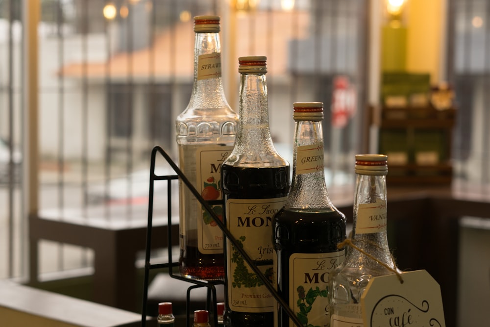 bottles of liquor are lined up on a shelf