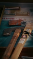 a pair of hammers and a pair of saws on a table