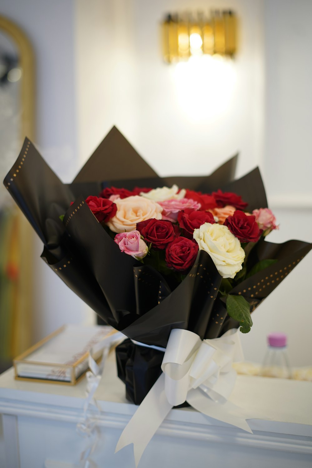 a bouquet of roses sitting on top of a table