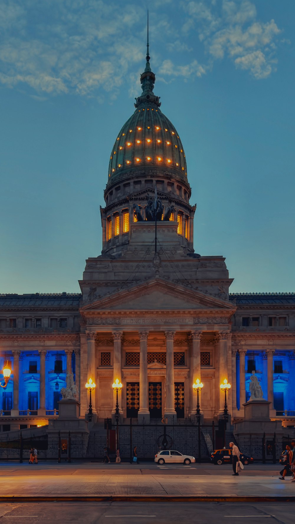 a large building with a dome lit up at night