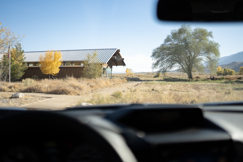 a view of a house from inside a vehicle