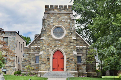 a church with a red door and a red door
