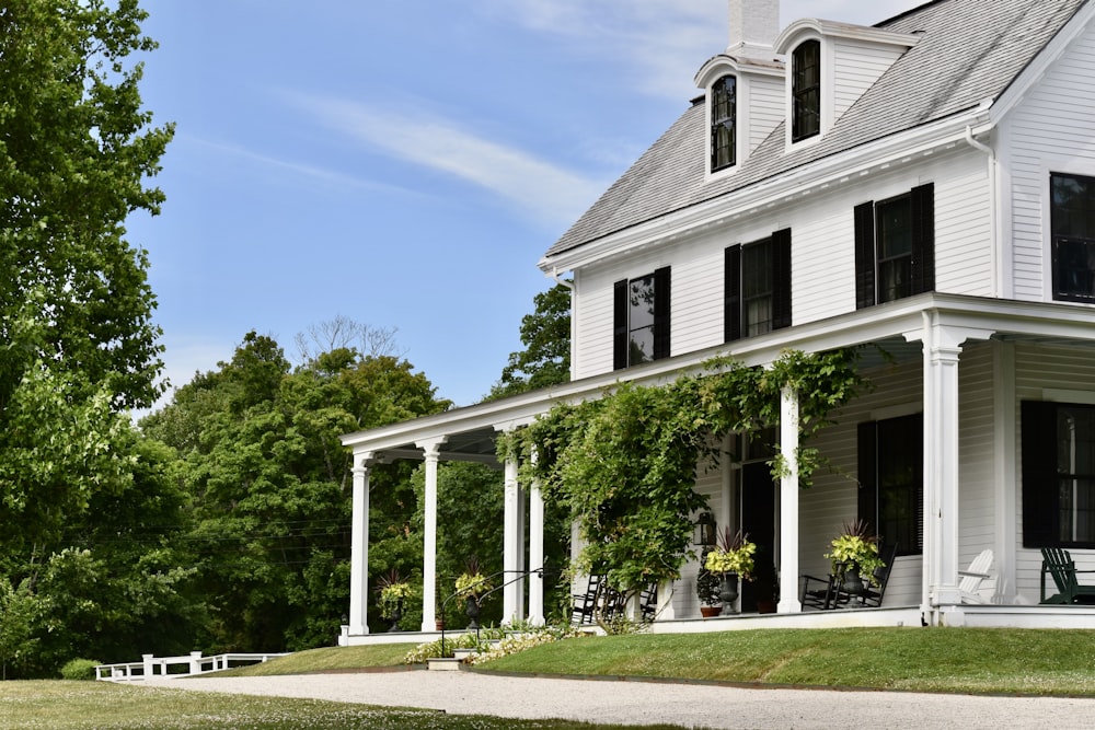 a large white house with columns and a porch