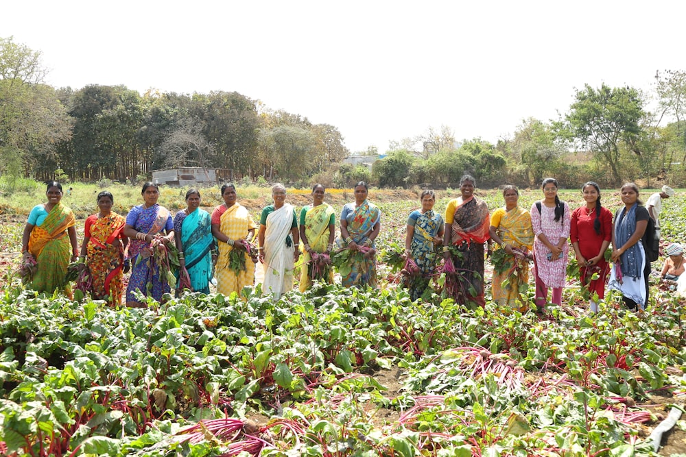 a group of people standing in a field