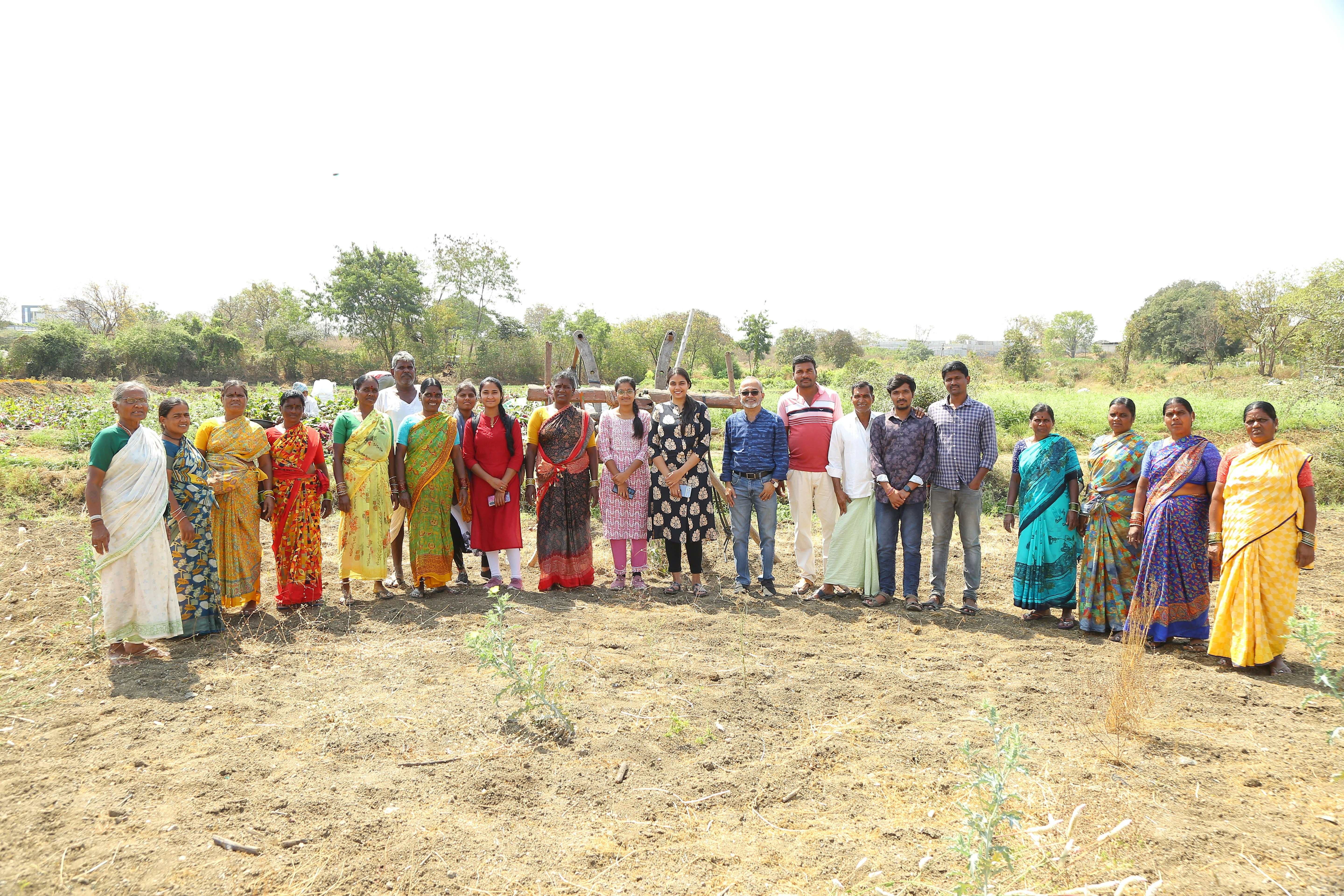 a group of people standing in a field
