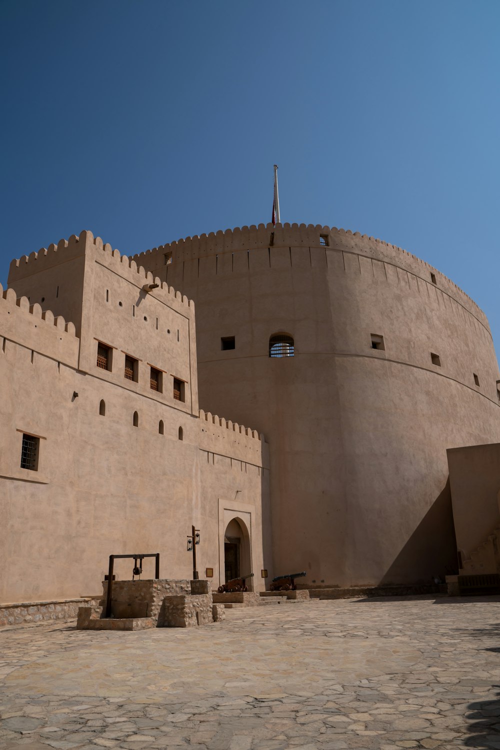 a large building with a clock on the side of it