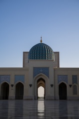 a large white building with a blue dome