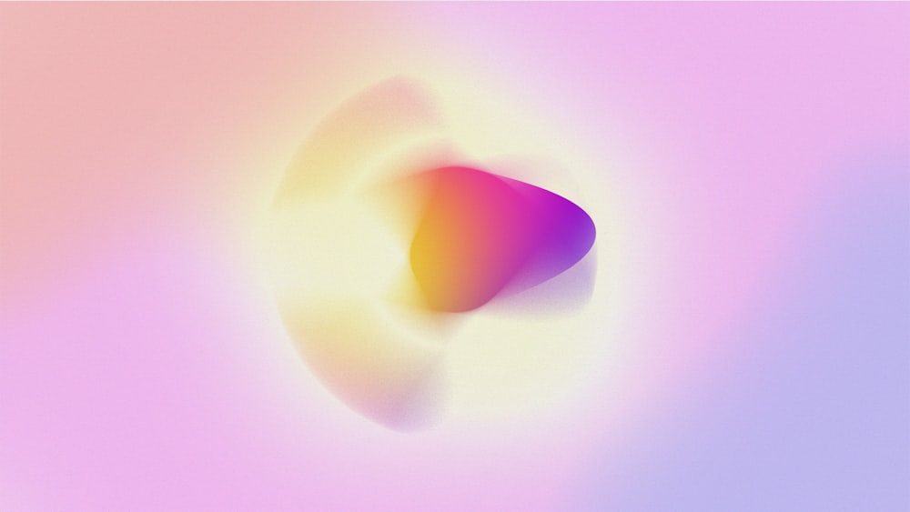 a blurry image of a pink and yellow object