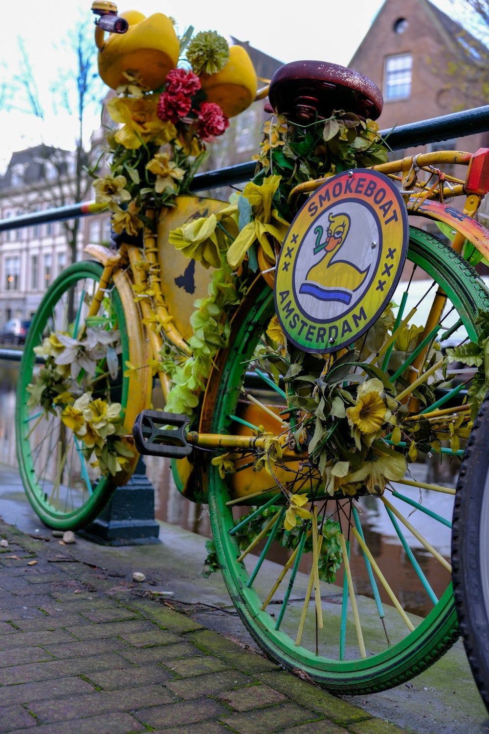 a bicycle decorated with flowers on a city street