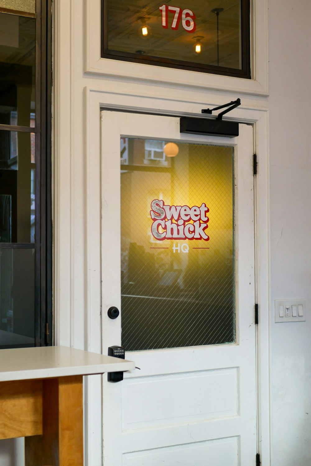 a sign on a door that says sweet chick