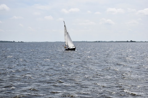 a sailboat in the middle of a large body of water