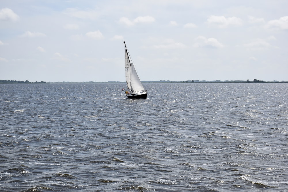 a sailboat in the middle of a large body of water