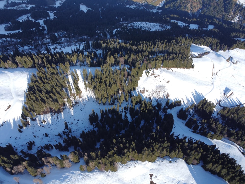 an aerial view of a snow covered mountain