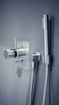 a shower head with a hose attached to it