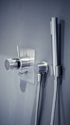 a shower head with a hose attached to it
