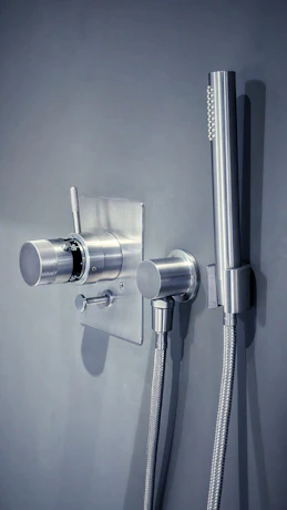 a shower head with a hose attached to it