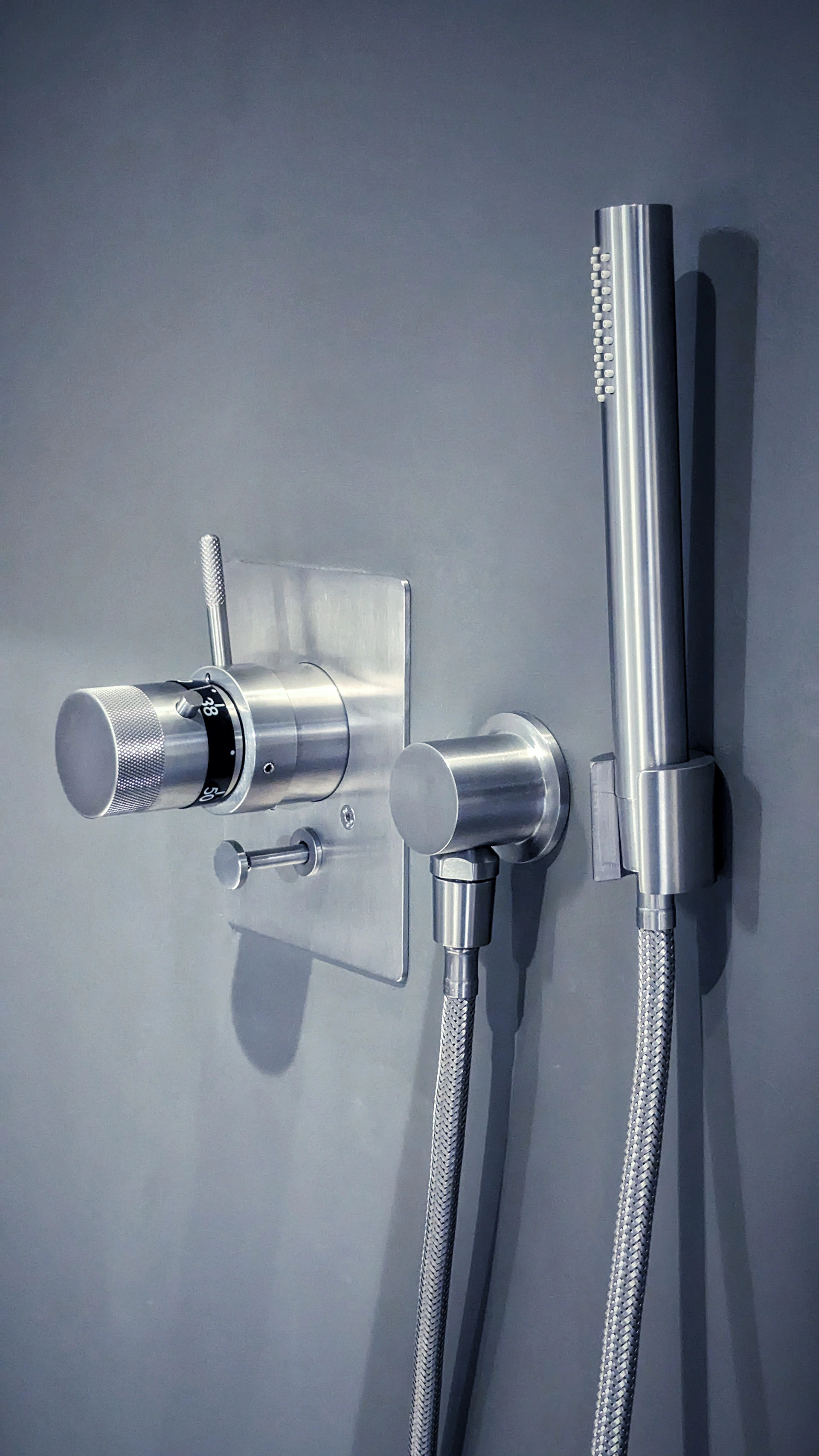 a shower head with a hose attached to it