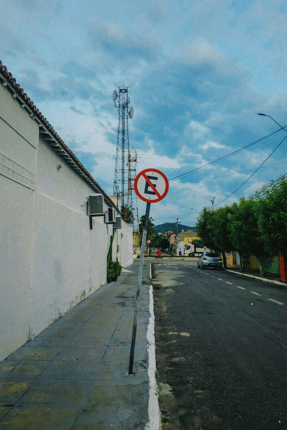 a no left turn sign on the side of a road