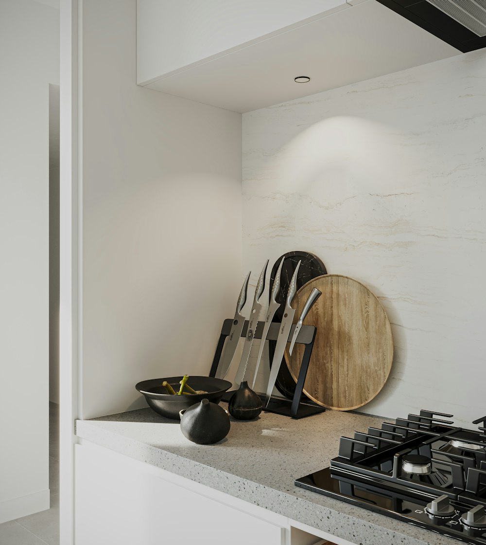 a kitchen counter with a cutting board and knives on it