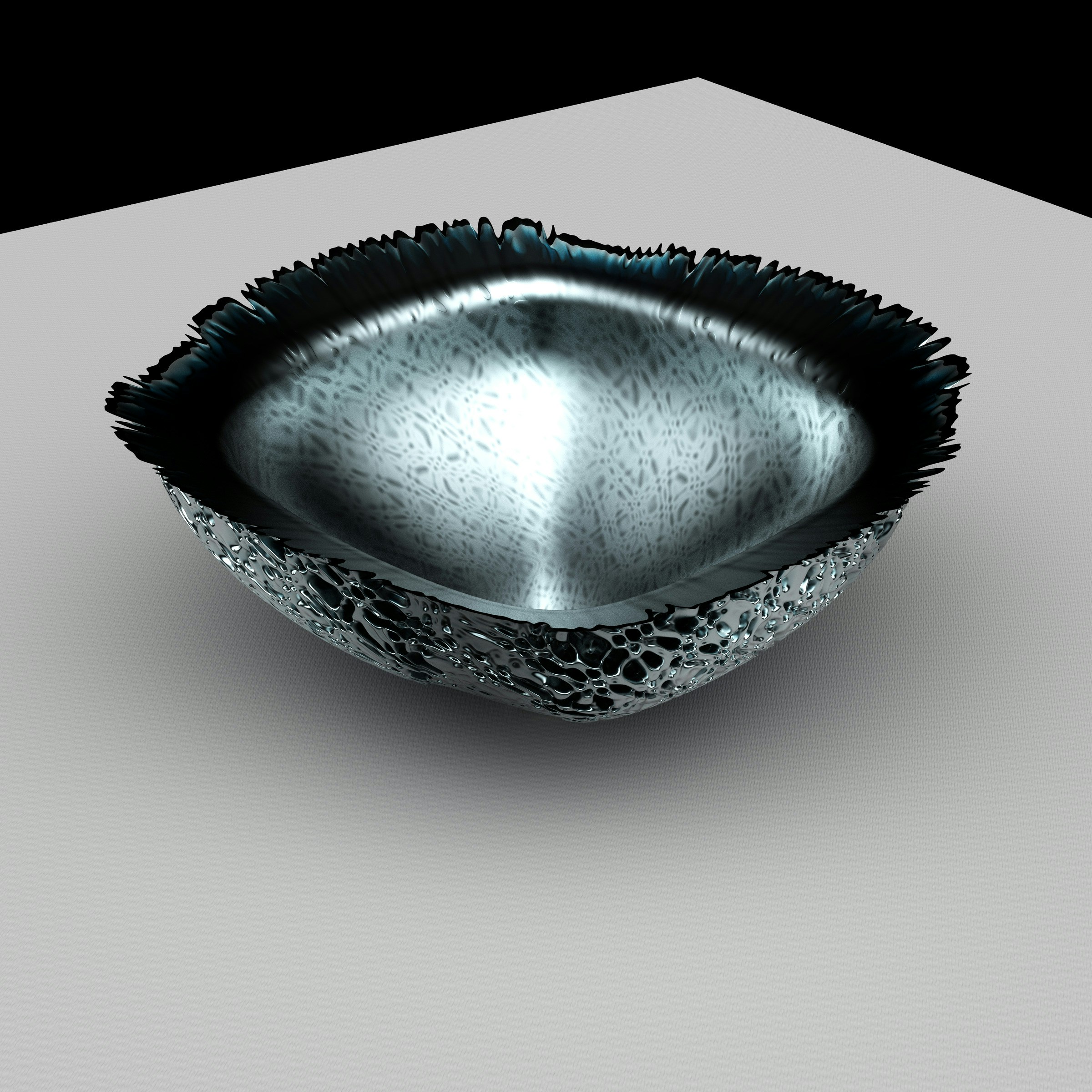 a metal bowl sitting on top of a table
