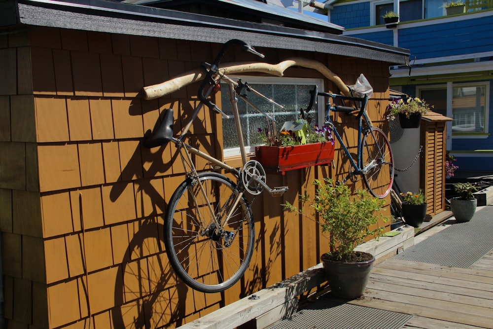 a bicycle mounted to the side of a building