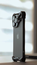 the back of an iphone case sitting on top of a table