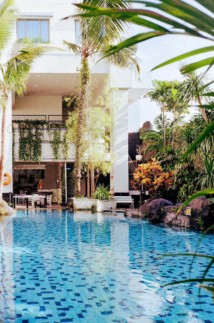 A serene luxury pool in a lush Javanese resort
