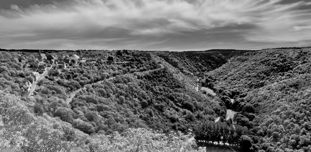 a black and white photo of a valley