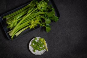 a bunch of celery sitting on top of a table