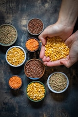 a person holding a handful of food in their hands
