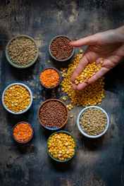 a person reaching for some food in small bowls