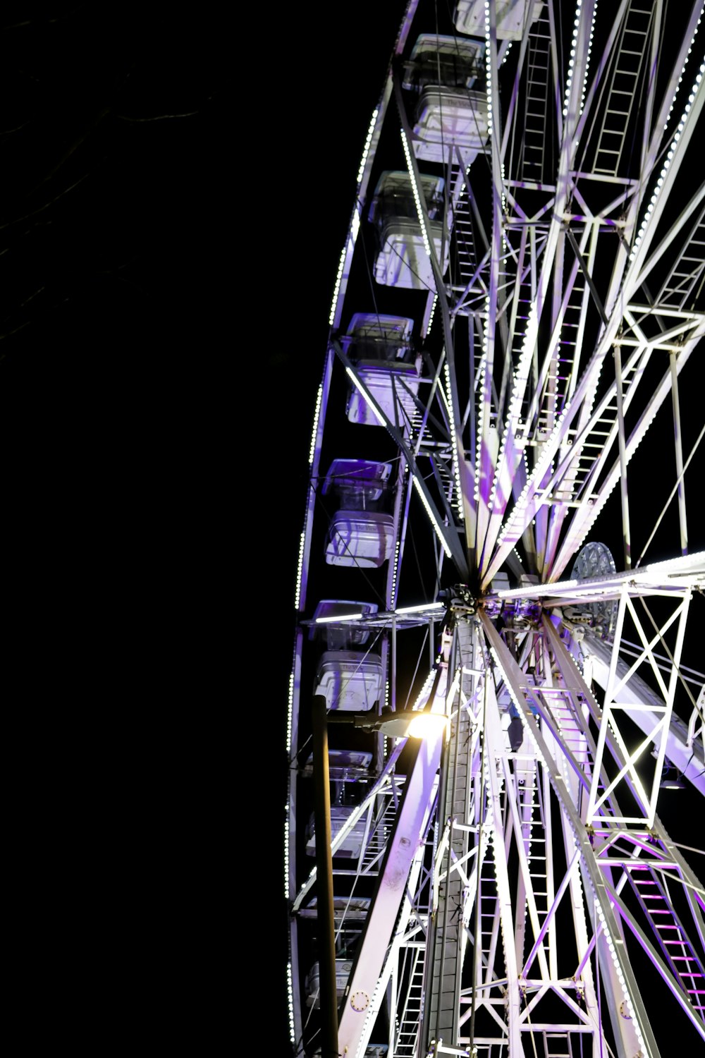 a large ferris wheel lit up at night