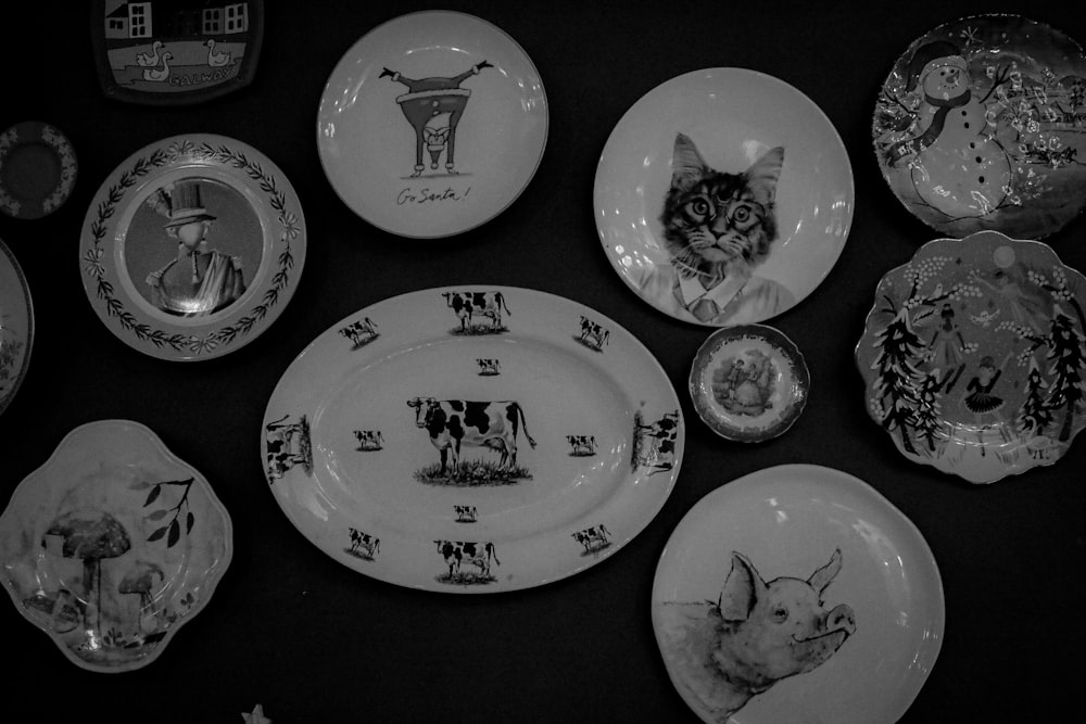 a black and white photo of a collection of plates
