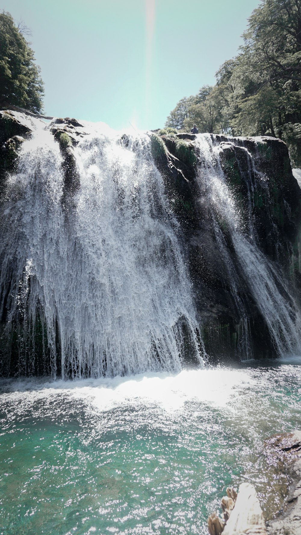 a large waterfall with lots of water coming out of it