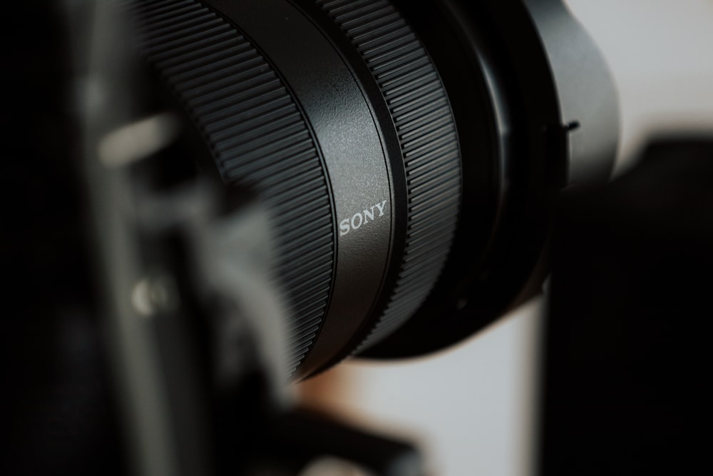 a close up of a camera lens on a tripod