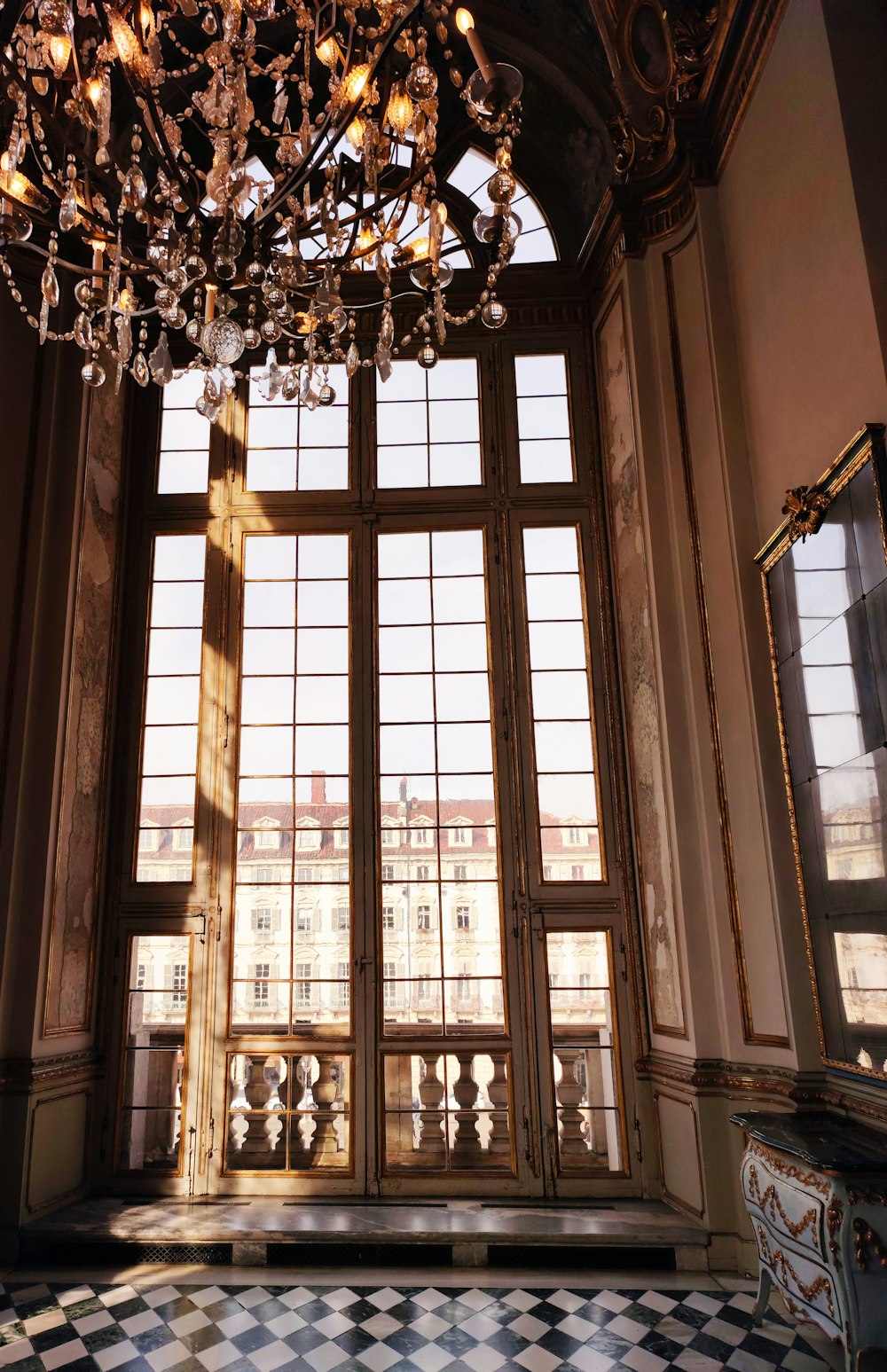 a chandelier hanging from the ceiling of a room